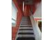 Stairway with natural light, wood flooring, and white trim at 3035 Graceland Ave, Indianapolis, IN 46208