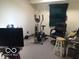 Living room with exercise equipment and flat screen TV at 3036 Chase St, Indianapolis, IN 46217