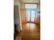 Living room with hardwood floors and decorative transom window above doorway at 3036 Chase St, Indianapolis, IN 46217