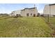 Spacious backyard featuring a chain-link fence and a large grassy area perfect for outdoor activities at 3313 Capsella Ln, Indianapolis, IN 46203