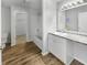 Clean bathroom featuring a tub, modern vanity with granite countertops, and ample lighting at 3313 Capsella Ln, Indianapolis, IN 46203