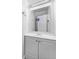 Compact bathroom showcasing a modern vanity, sink, and a frameless mirror at 3313 Capsella Ln, Indianapolis, IN 46203