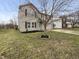 Charming two-story home featuring a well-maintained lawn, black mulch and a light blue front door at 3313 Capsella Ln, Indianapolis, IN 46203
