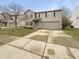 Charming home with a well-manicured lawn and driveway, complimented by a light blue front door at 3313 Capsella Ln, Indianapolis, IN 46203