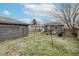 Spacious backyard featuring green grass, a privacy fence, and a storage shed at 4910 East 21St St, Indianapolis, IN 46218