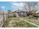Backyard featuring a small patio and ample green space at 4910 East 21St St, Indianapolis, IN 46218