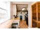 Bright kitchen featuring light countertops, stainless steel refrigerator, and wooden cabinets at 4910 East 21St St, Indianapolis, IN 46218