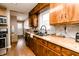 Traditional kitchen featuring wood cabinets, butcher block counters, gray backsplash, and stainless steel appliances at 4910 East 21St St, Indianapolis, IN 46218