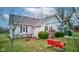 Quaint home featuring a swing set in a well-maintained backyard at 502 E Washington St, Summitville, IN 46070