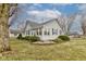 Charming single-story home with gray siding, manicured landscaping, and a welcoming front entrance at 502 E Washington St, Summitville, IN 46070