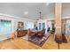 Elegant dining room featuring hardwood floors, a decorative rug, and ample natural light creating an ideal setting for gatherings at 518 N Emerson Ave, Indianapolis, IN 46219