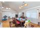 Bright dining room with hardwood floors and large windows, providing a welcoming atmosphere for Gathering meals and entertaining at 518 N Emerson Ave, Indianapolis, IN 46219