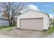 Two-car garage with an gray door, offering ample parking and storage at 518 N Emerson Ave, Indianapolis, IN 46219