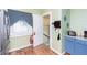 Cozy kitchen with wood-look flooring and a window for natural light at 518 N Emerson Ave, Indianapolis, IN 46219