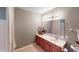 Clean and well-maintained bathroom with a vanity, mirror, and shower curtain, offering a functional design at 5180 Dunewood Way # 57, Avon, IN 46123