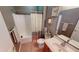 Cozy bathroom with a tub-shower combination and decorative artwork enhancing the room's charm at 5180 Dunewood Way # 57, Avon, IN 46123