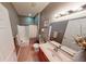 Well-lit bathroom featuring a shower-tub combo and modern fixtures, providing a functional and stylish space at 5180 Dunewood Way # 57, Avon, IN 46123