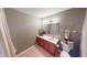 A well-lit bathroom with a spacious vanity, classic mirror, and neutral color palette at 5180 Dunewood Way # 57, Avon, IN 46123
