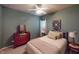 Comfortable bedroom featuring a bed, dresser, ceiling fan, and natural light at 5180 Dunewood Way # 57, Avon, IN 46123