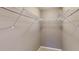 Walk-in closet space with white wire shelving and neutral-colored walls at 5180 Dunewood Way # 57, Avon, IN 46123