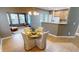 Cozy dining area with tile floors, chandelier, natural light, and an open concept layout at 5180 Dunewood Way # 57, Avon, IN 46123
