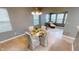Cozy dining room featuring a chandelier and ample natural light, ideal for intimate meals and gatherings at 5180 Dunewood Way # 57, Avon, IN 46123