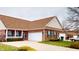 Charming brick house with green shutters, white trim, a large yard, and a driveway at 5180 Dunewood Way # 57, Avon, IN 46123