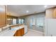 Bright kitchen featuring laminate countertops, a white dishwasher, and ample natural light at 5180 Dunewood Way # 57, Avon, IN 46123