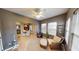 Comfortable living room with a wicker chair, ottoman, and dining area view at 5180 Dunewood Way # 57, Avon, IN 46123