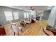 Bright and airy living room with hardwood floors, comfortable seating, and a fireplace at 5180 Dunewood Way # 57, Avon, IN 46123