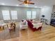 Bright living room featuring hardwood floors, neutral walls, fireplace, and comfortable seating at 5180 Dunewood Way # 57, Avon, IN 46123