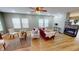 Hardwood floors, large windows, comfortable seating, fireplace, and open floor plan in this gorgeous living room at 5180 Dunewood Way # 57, Avon, IN 46123