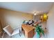 Bright living room with ceiling fan, comfortable seating, and desk space at 5180 Dunewood Way # 57, Avon, IN 46123