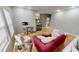 Bright living room showcasing hardwood floors, comfortable seating, fireplace, and view of the kitchen at 5180 Dunewood Way # 57, Avon, IN 46123