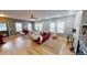 Inviting living room with natural light, neutral tones, hardwood floors, modern furniture, and a cozy ambiance at 5180 Dunewood Way # 57, Avon, IN 46123