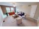 Spacious living room featuring neutral carpets, abundant natural light, and inviting seating area at 5180 Dunewood Way # 57, Avon, IN 46123