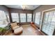 Inviting sun room with plenty of windows, a ceiling fan, neutral-colored walls, and comfortable seating at 5180 Dunewood Way # 57, Avon, IN 46123