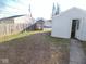 Backyard with a detached garage and grass yard at 55 S 4Th Ave, Beech Grove, IN 46107