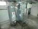 This unfinished basement features water heater and furnace at 55 S 4Th Ave, Beech Grove, IN 46107