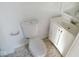 Clean bathroom featuring a toilet and vanity with sink at 55 S 4Th Ave, Beech Grove, IN 46107