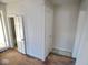 A simple hallway area with door and closet spaces for storage at 55 S 4Th Ave, Beech Grove, IN 46107
