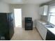 The kitchen features modern appliances and ample counter space at 55 S 4Th Ave, Beech Grove, IN 46107