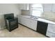 Functional kitchen with white cabinets, a black oven, and modern appliances at 55 S 4Th Ave, Beech Grove, IN 46107