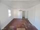 Open living room with a ceiling light fixture and a view into other rooms at 55 S 4Th Ave, Beech Grove, IN 46107