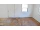 Bright room ready for your personal touch, featuring a door and windows at 55 S 4Th Ave, Beech Grove, IN 46107