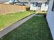 Backyard area showing a pathway, shed, and fenced yard at 611 W South St, Shelbyville, IN 46176