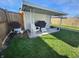 Cozy backyard featuring a covered patio area, perfect for outdoor relaxation and grilling at 611 W South St, Shelbyville, IN 46176
