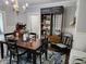 Bright dining room with a wooden table, a chandelier, and custom hydroponic shelving at 611 W South St, Shelbyville, IN 46176