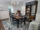 Charming dining room with a wooden table, a chandelier, and custom hydroponic shelving at 611 W South St, Shelbyville, IN 46176