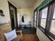 Inviting entryway with wooden floors, coat hooks, and a bench with storage for shoes at 611 W South St, Shelbyville, IN 46176